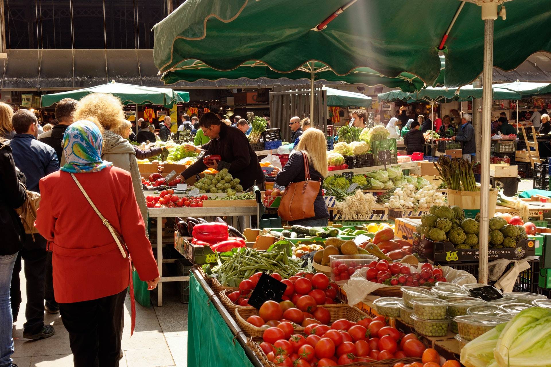 Farmers selling fruits and vegetables at a farmer’s market - GIBX stock news