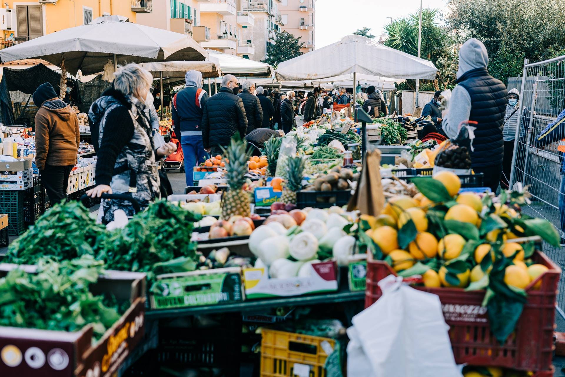 People shopping at a farmer’s market. - GIB exchange fraud scam